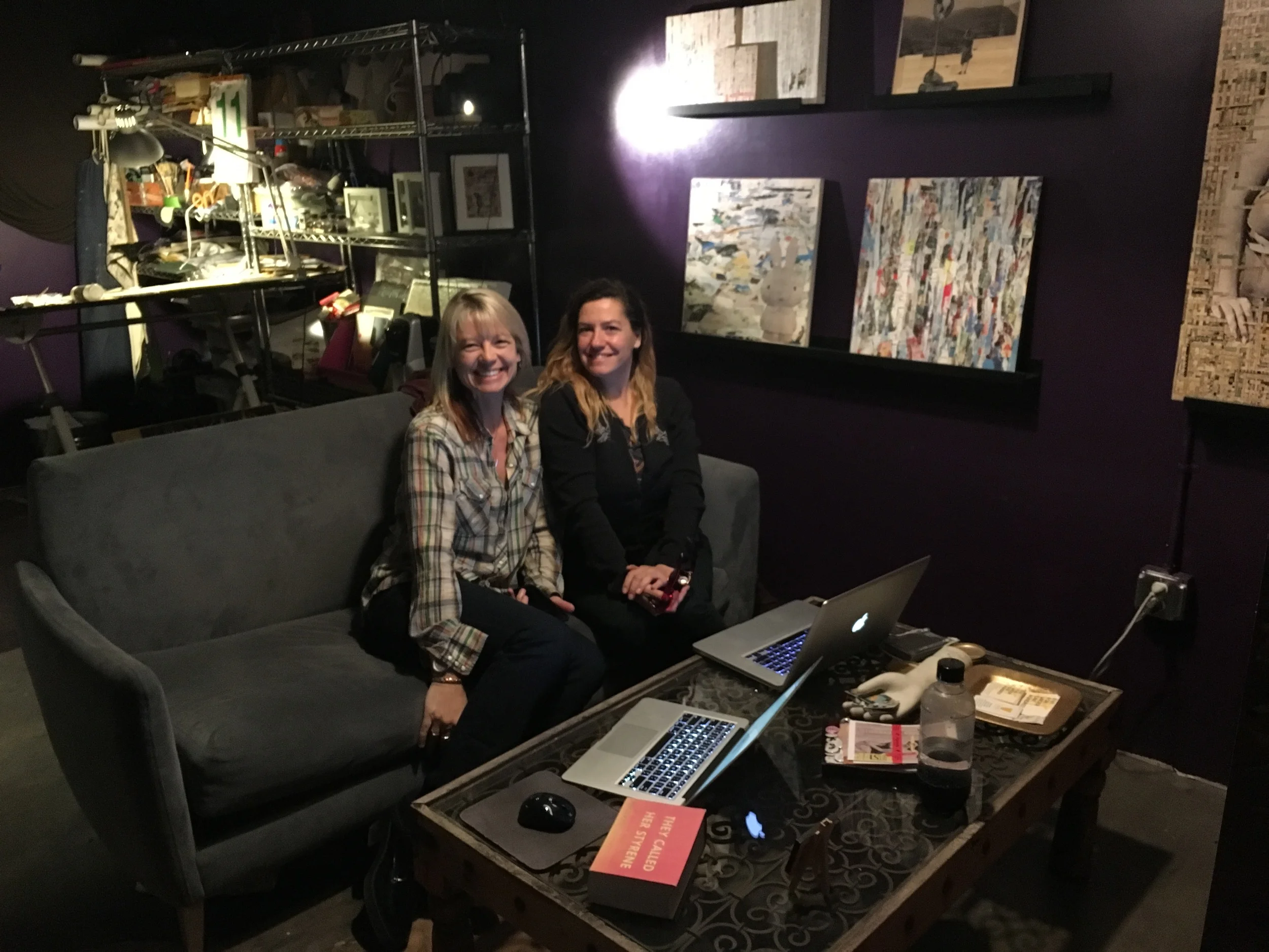Participating artist Marni Selmanson and exhibition coordinator and artist Sarah Gonsalves reviewing show details.