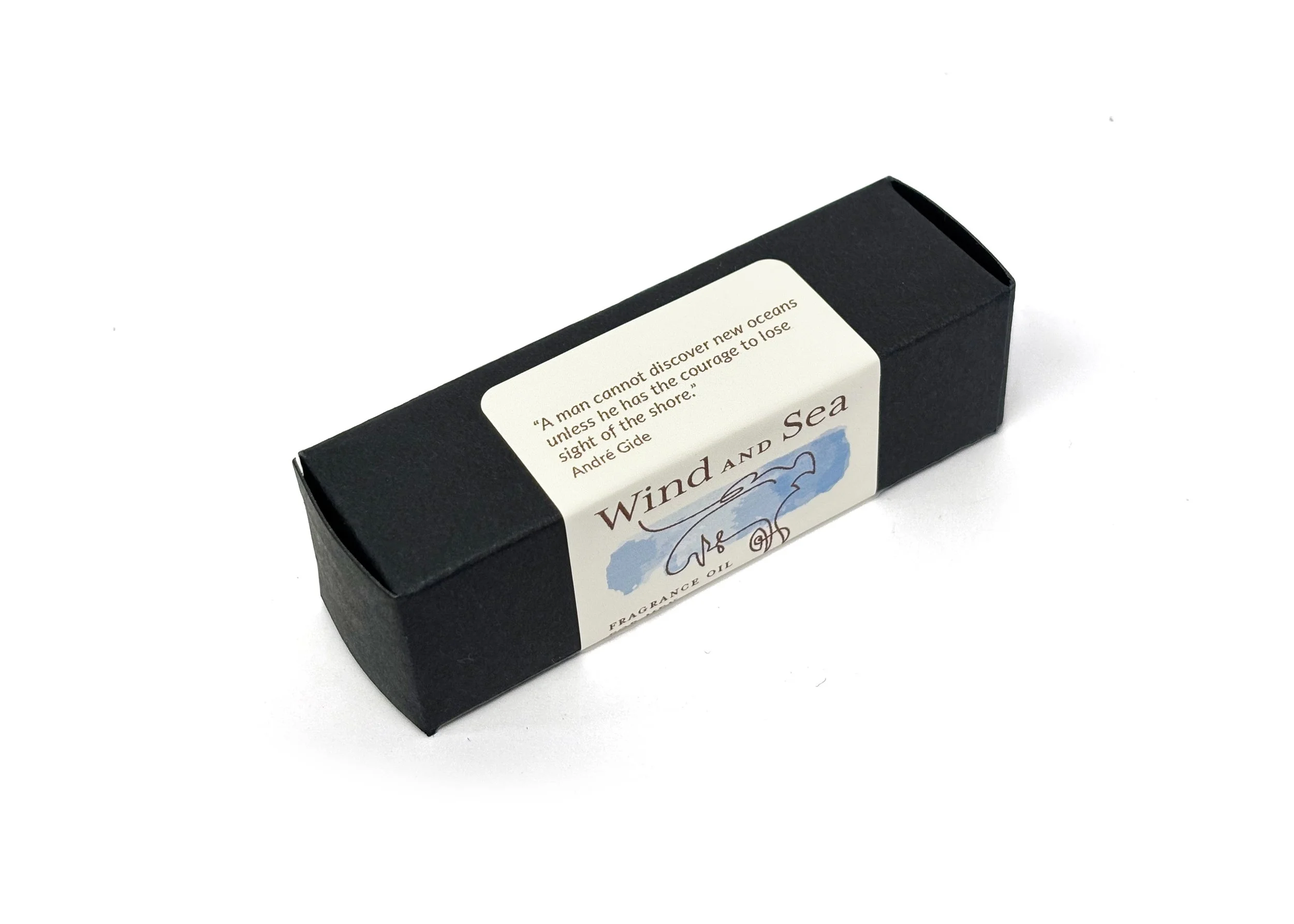 Wind and Sea natural fragrance oil for men in roll-on bottle with packaging, crafted with pure essential oils in organic MCT oil, highlighting rich, grounding notes.