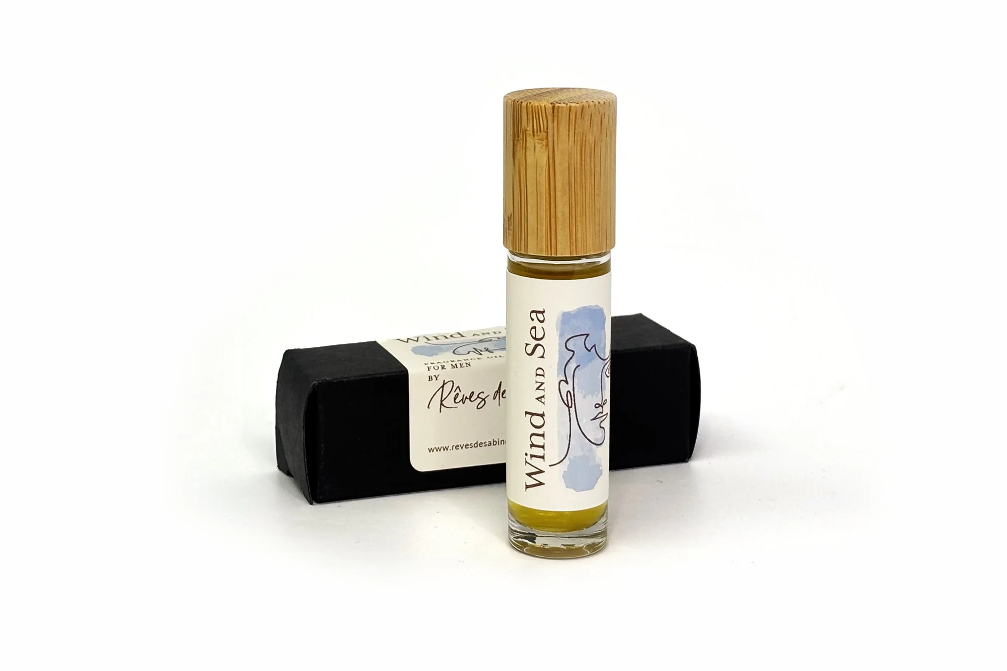 Wind and Sea natural fragrance oil for men in a roll-on bottle, featuring rich, grounding notes of lavender, sandalwood, vetiver, myrrh, frankincense, hyssop, and tobacco.