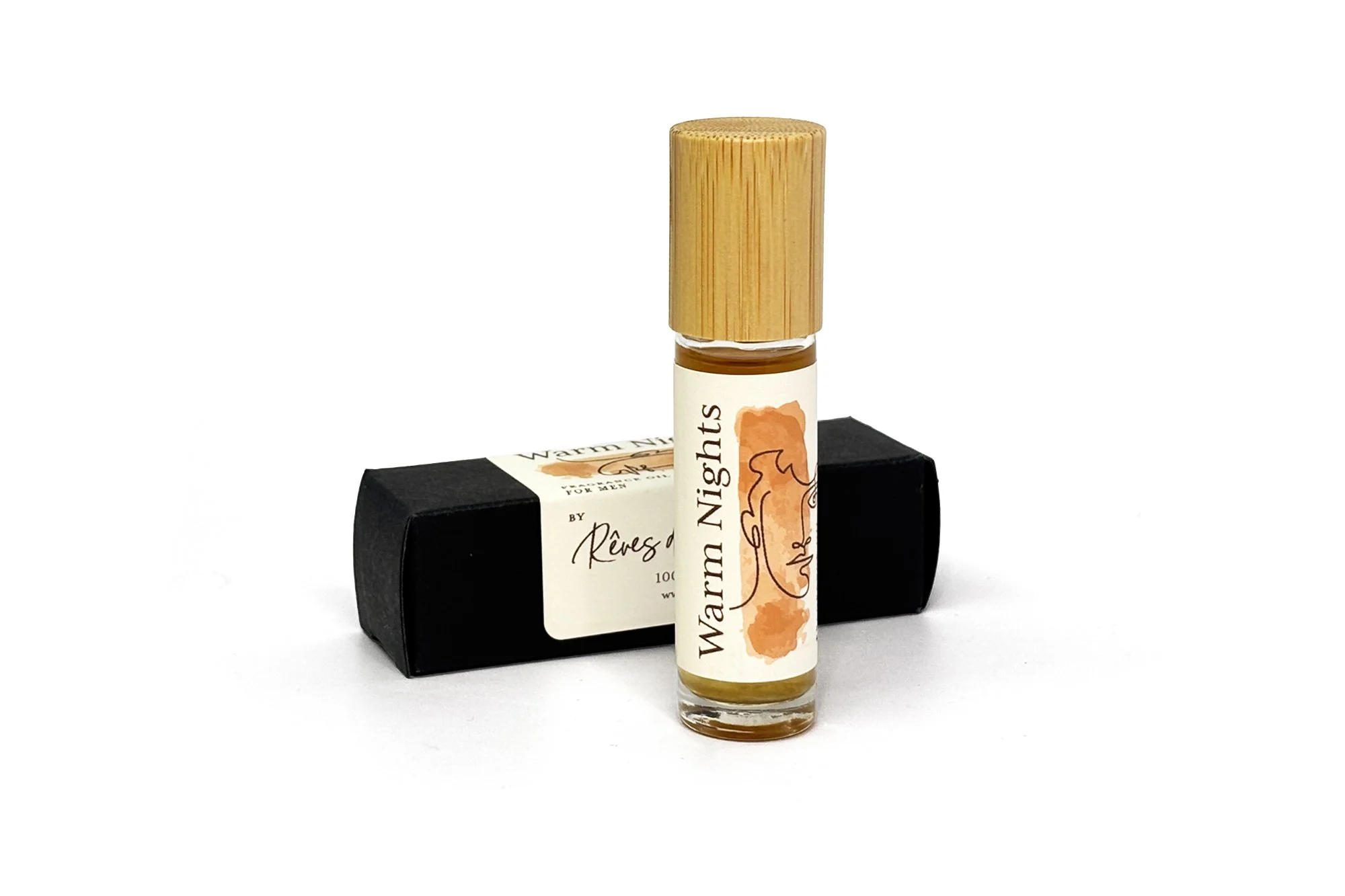 Warm Nights natural fragrance oil for men in a roll-on bottle, featuring warm, seductive tones of amber and rich botanicals.