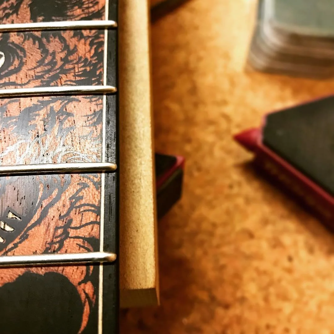 Frets are in, ends domed and dressed. Everything is now ready for the first string up before finish sanding.