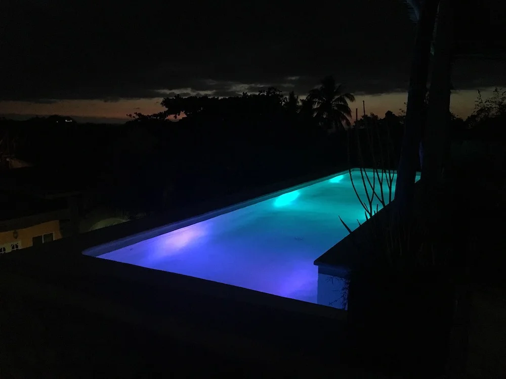 Rooftop pool at our Airbnb by night
