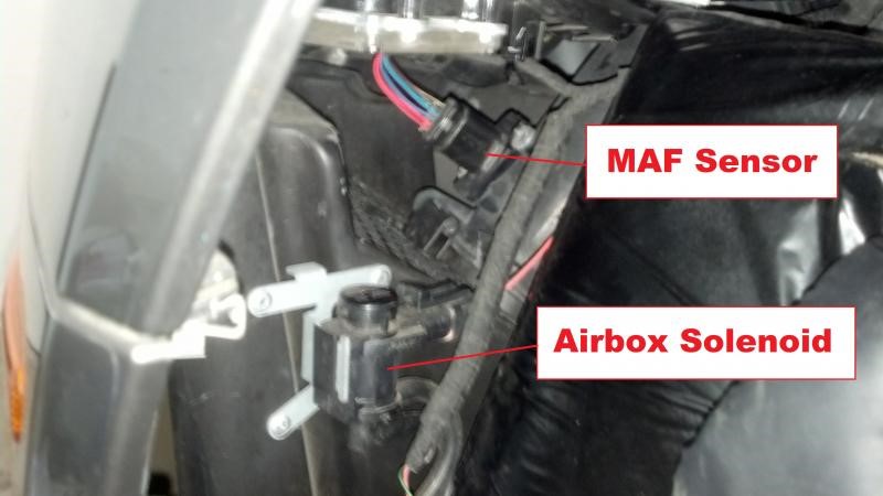 V8 Vantage airbox, flap solenoids, and MAF sensor harness plug.