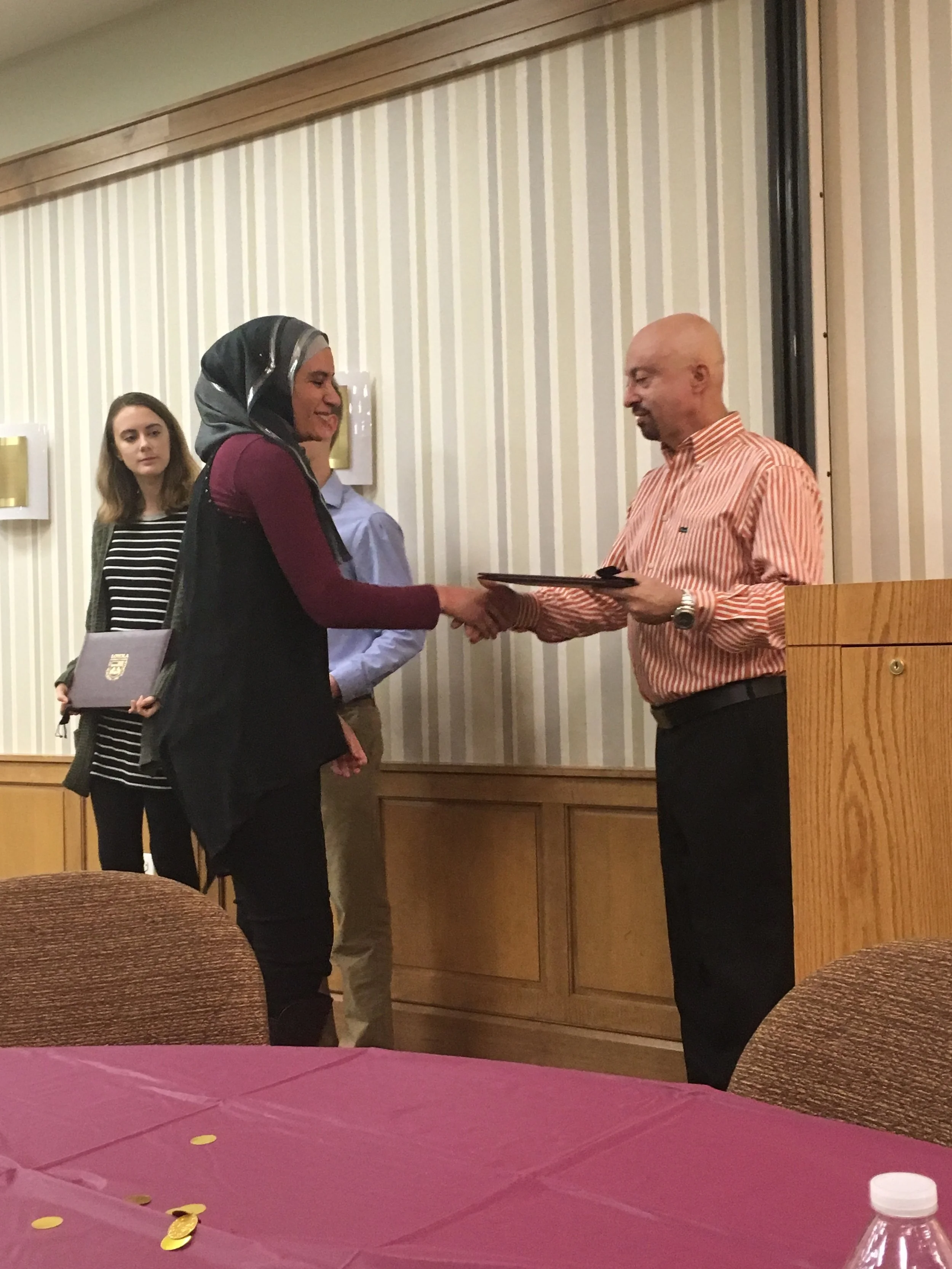  Iman Darwish being presented with the father Morrisey medal by Dr. de Freitas 