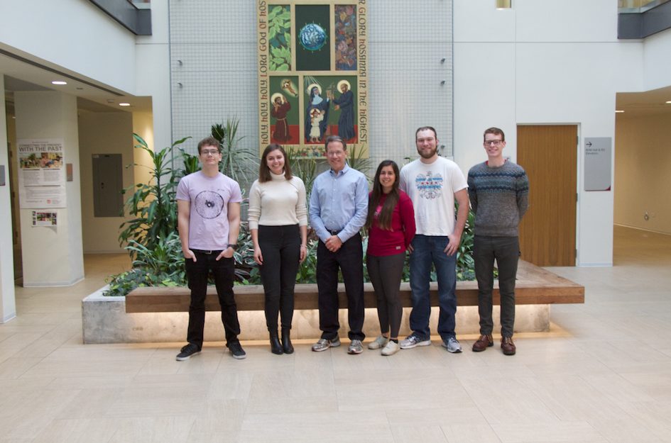Dr. Becker with the senior graduating class. Pictured from left to right: Max Moore, Yuliya Politanska, Rachel Torrez, JR Godlewski, and Peter Thoresen