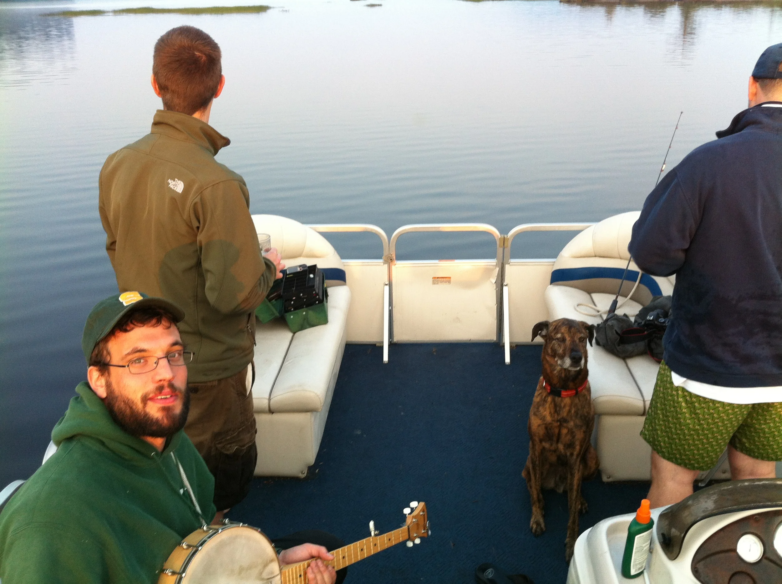 That's Teddy on the left, holding the banjo. The bachelor in question is on the left. The best man is to the right, assisted by the best dog.