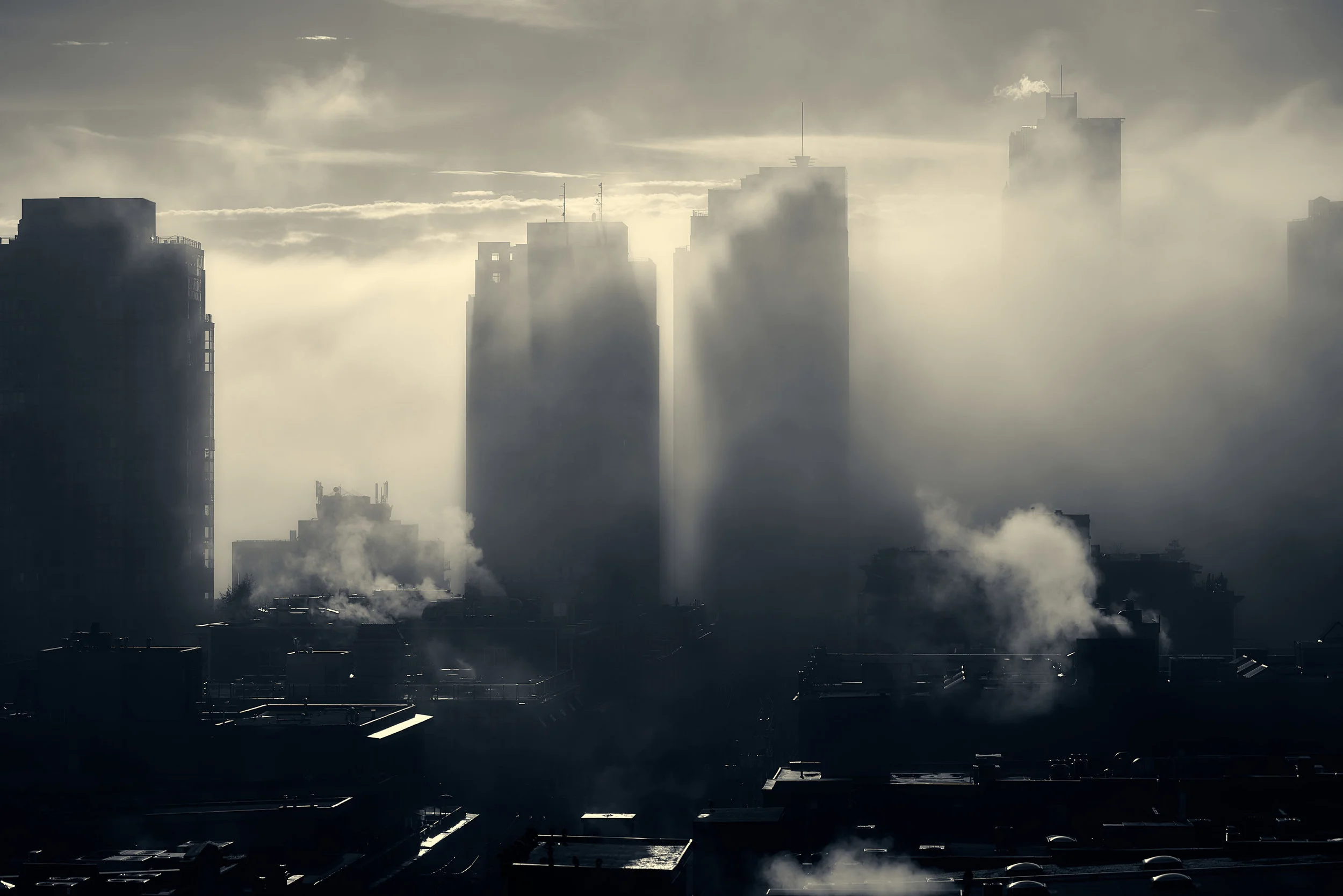  I strive to make my work appeal to a certain stylistic tone, but without saturating the captured image with over processing. This view from my balcony one winter morning was a perfect tone blend of noir with a early 21st century feel. 