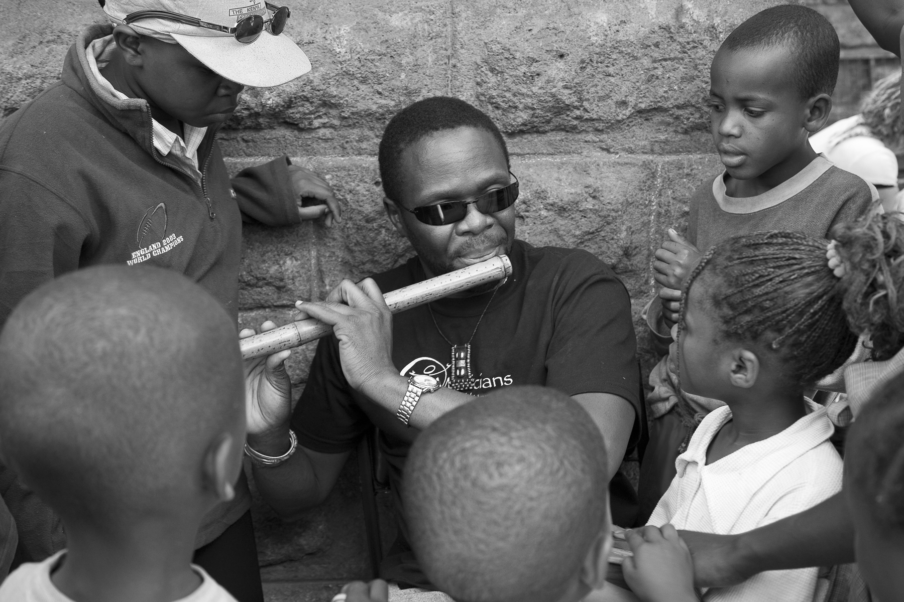 Samite Playing Flute at Shangilia.jpg