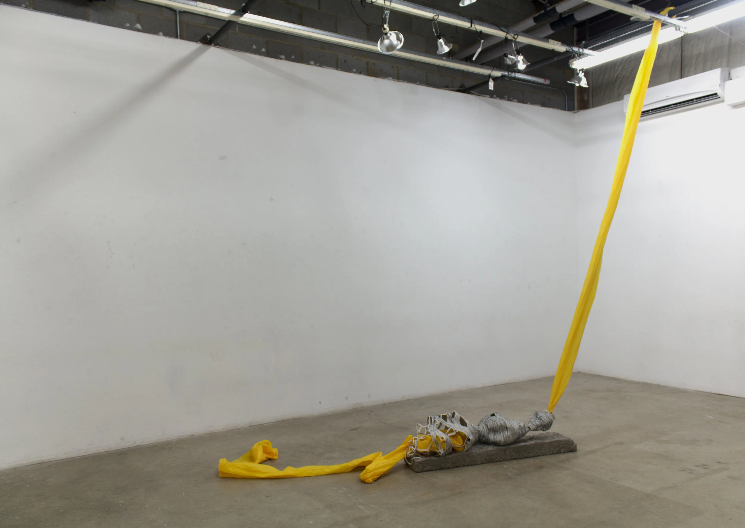 YellowCement, rope, thread, found fabric. 2017