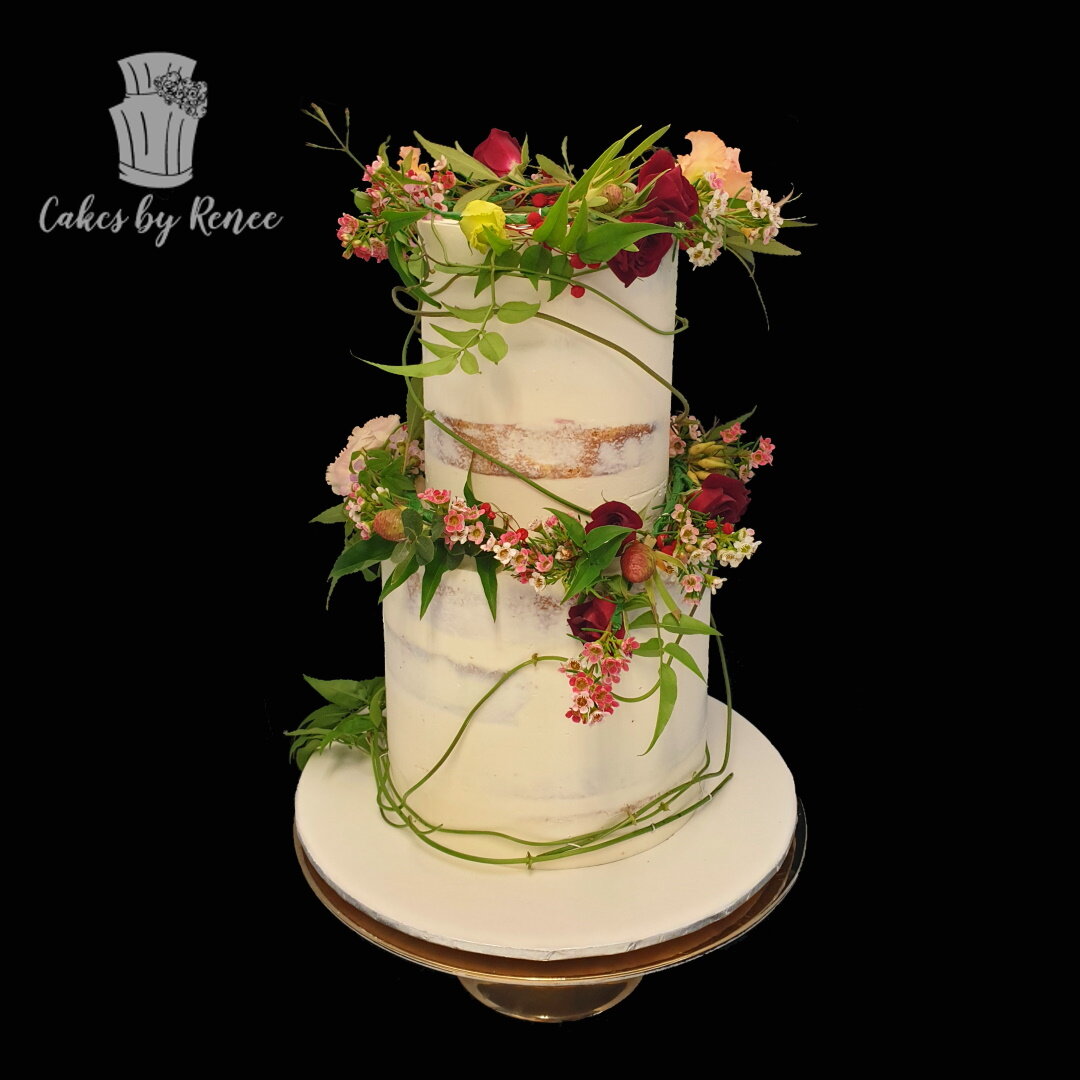 2 tier semi naked wedding cake vines floral bands wreaths spring wedding