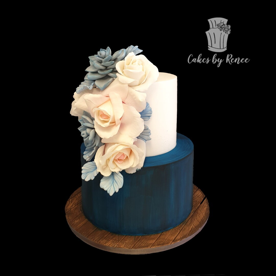 2 tier wedding cake succulents navy blue peach flowers