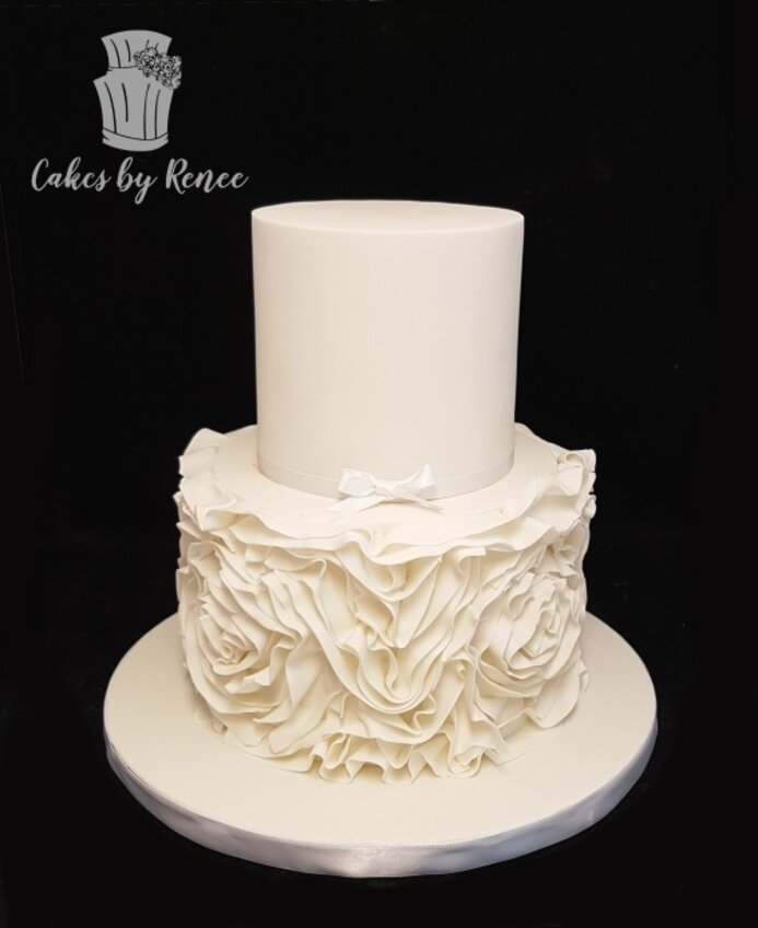 2 tier white wedding cake fondant frills ruffles rosettes