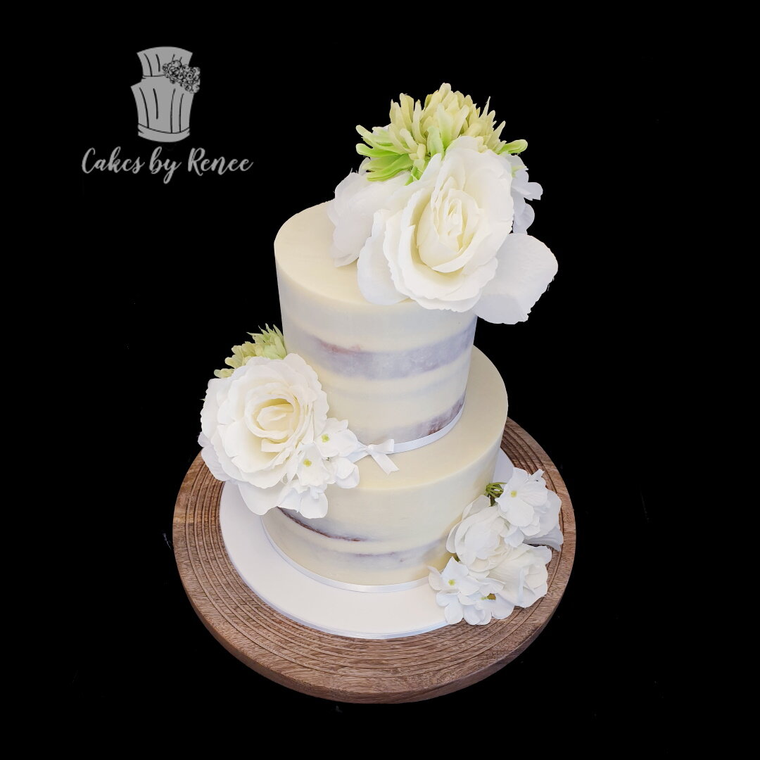 2 tier semi naked wedding cake fresh flowers