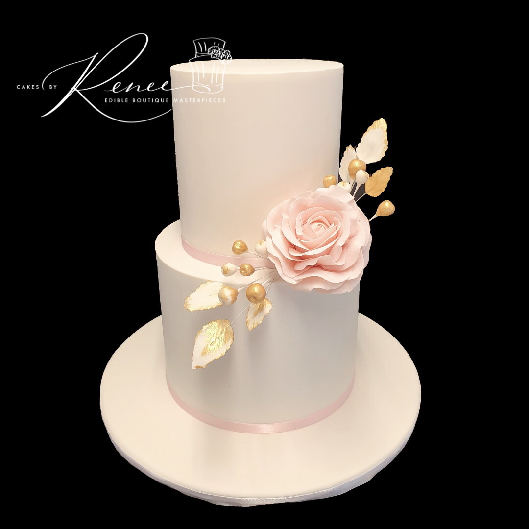 2 tier white wedding cake pink flowers simple