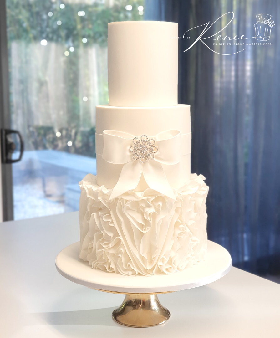 3 tier white wedding cake fondant ruffles frills bow