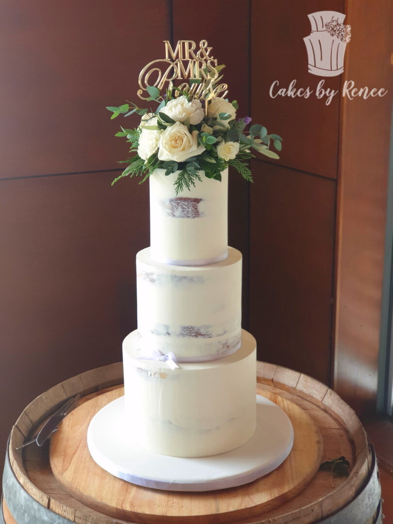 3 tier semi naked wedding cake fresh flowers custom topper