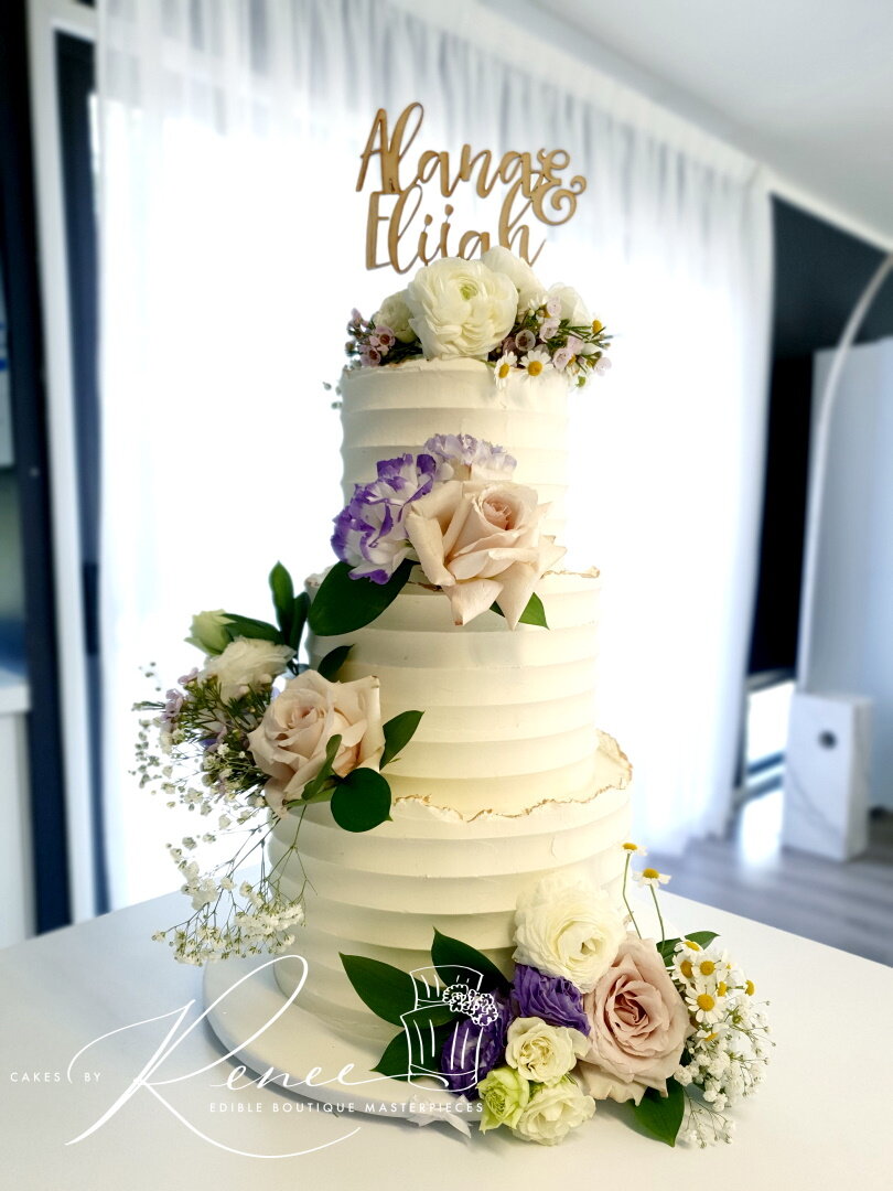 3 tier textured butterceam wedding cake fresh flowers custom topper
