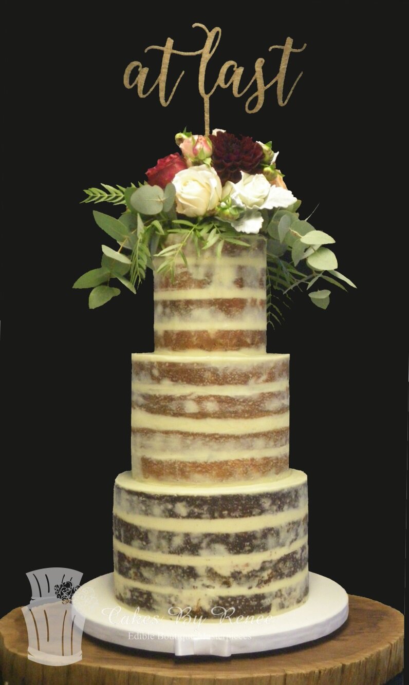 3 tier semi naked wedding cake fresh flowers custom topper