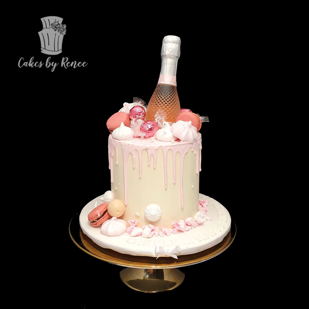 pink champagne bottle drip cake pink