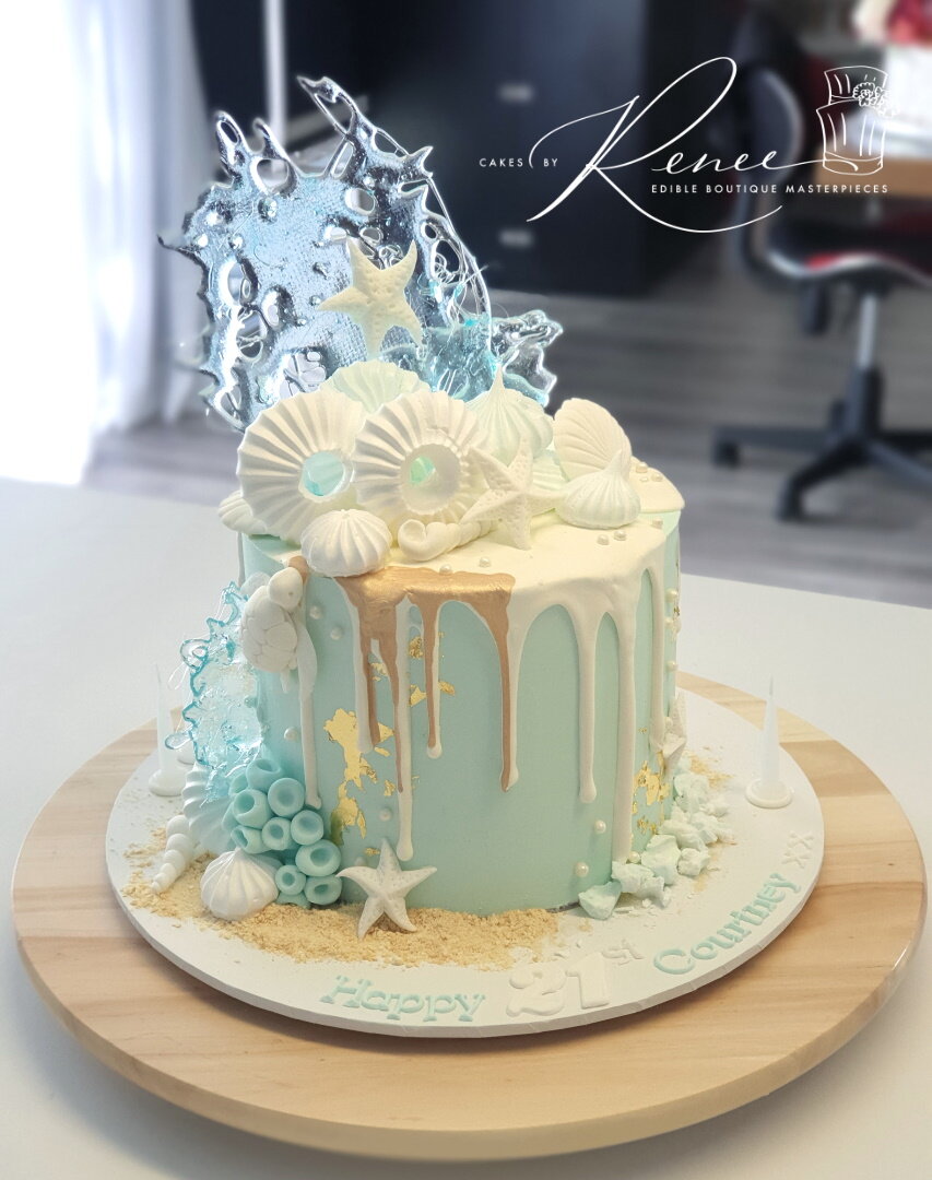 ocean theme drip cake blue white gold isomalt