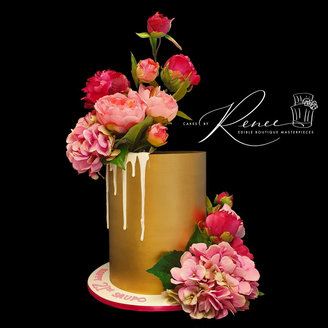 gold tall drip cake pink flowers