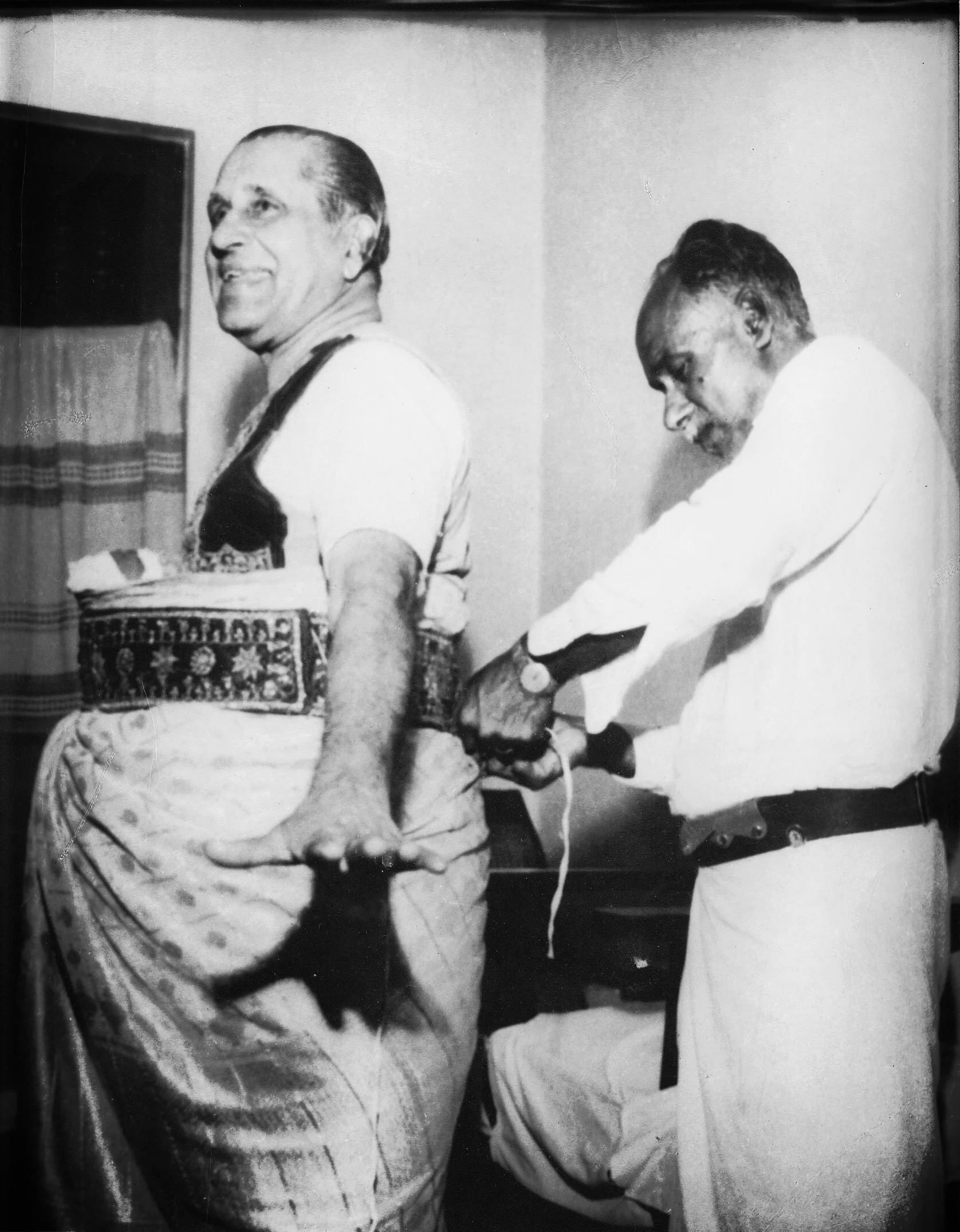 Diyawadana Nilame H.B. Udurawana getting dressed for the Kandy Esala Perahera
