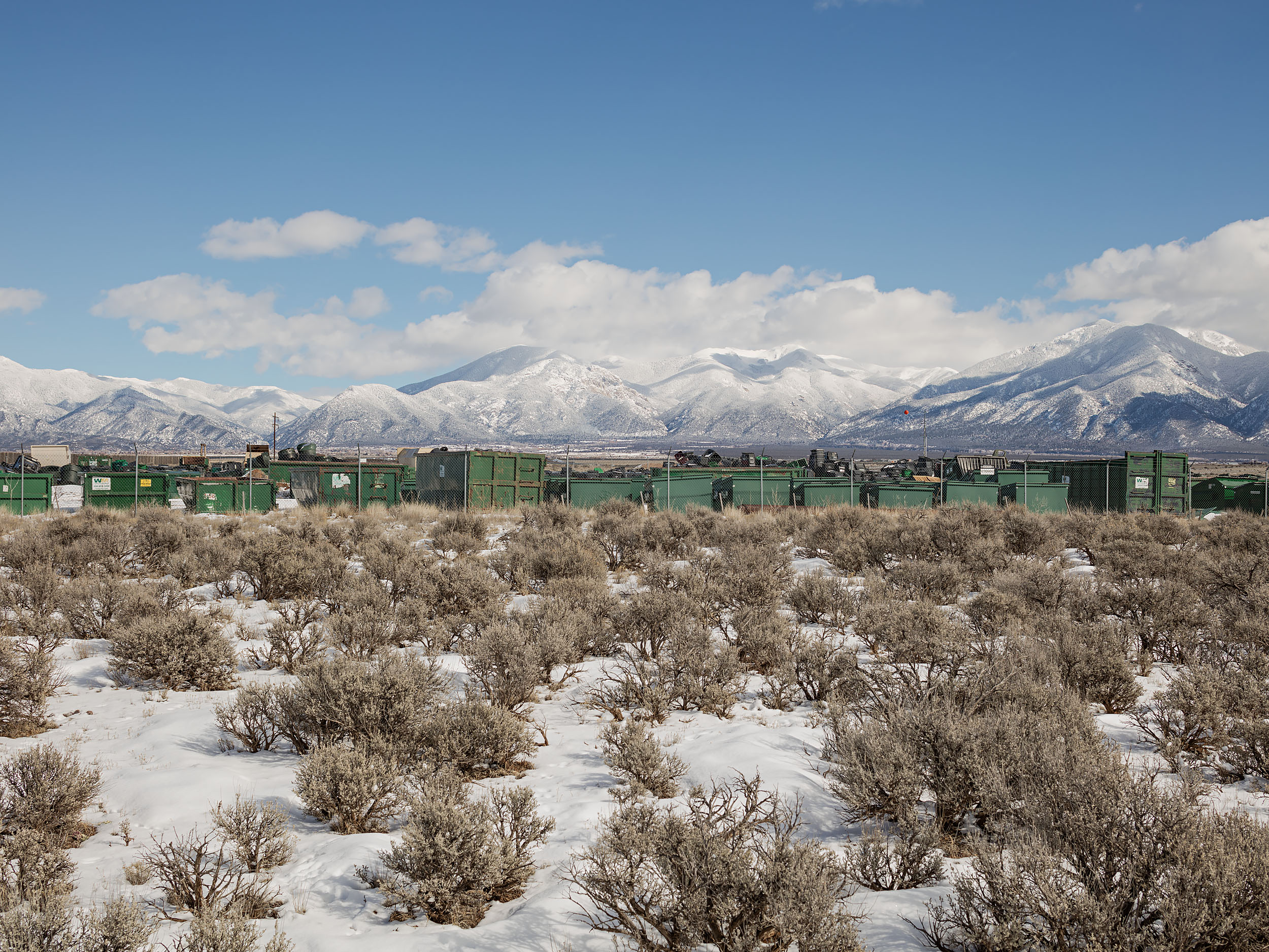 Waste Management Dumpster Yard and Sangre De Cristo Mountains - Taos, NM