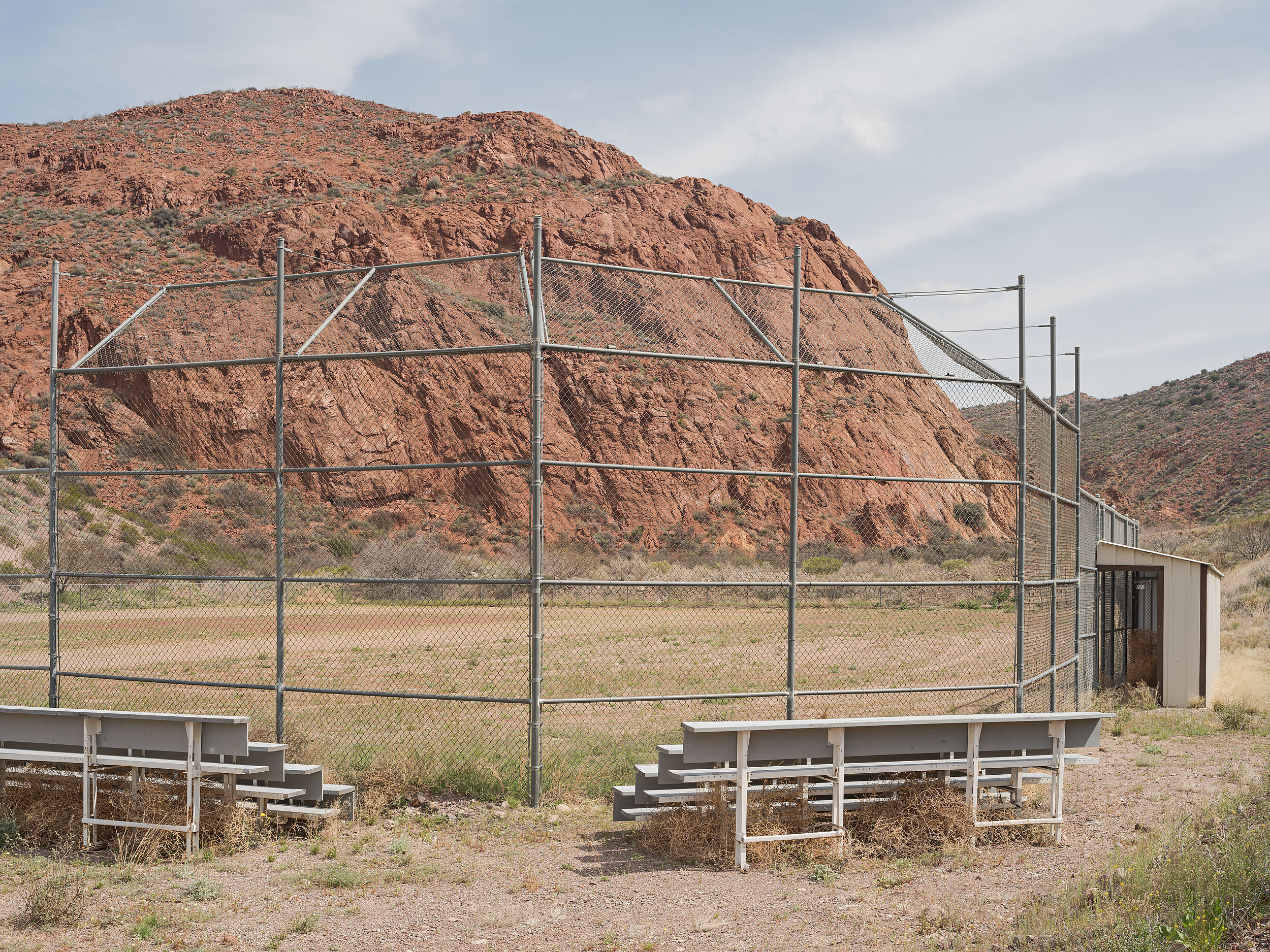 Unidentified park with baseball field and Red Canyon, Clifton AZ. Clifton is adjacent to Morenci, and together are considered to be an economic unit by the Arizona Department of Commerce.