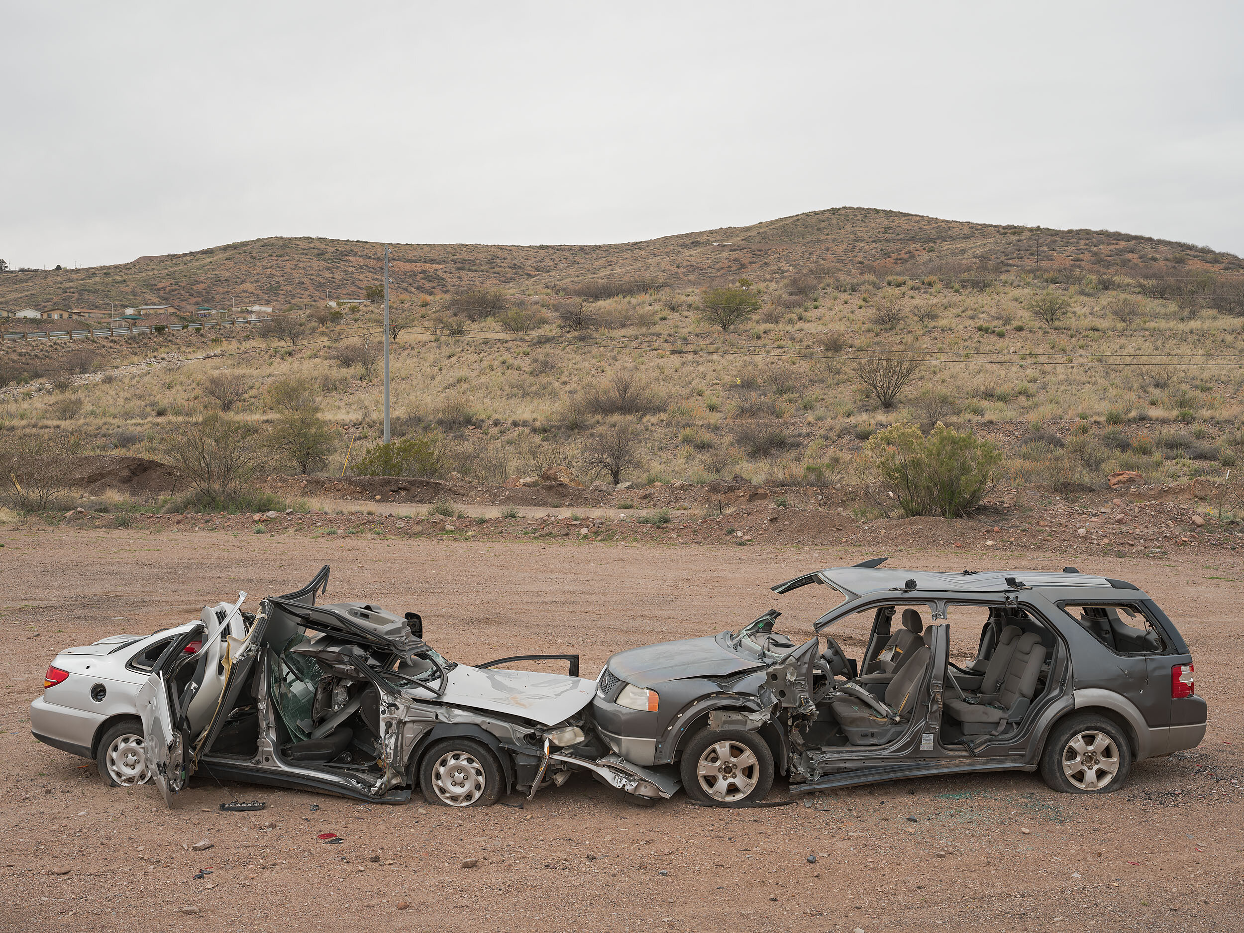 Wrecked cars near the "Copper Verde" neighborhood
