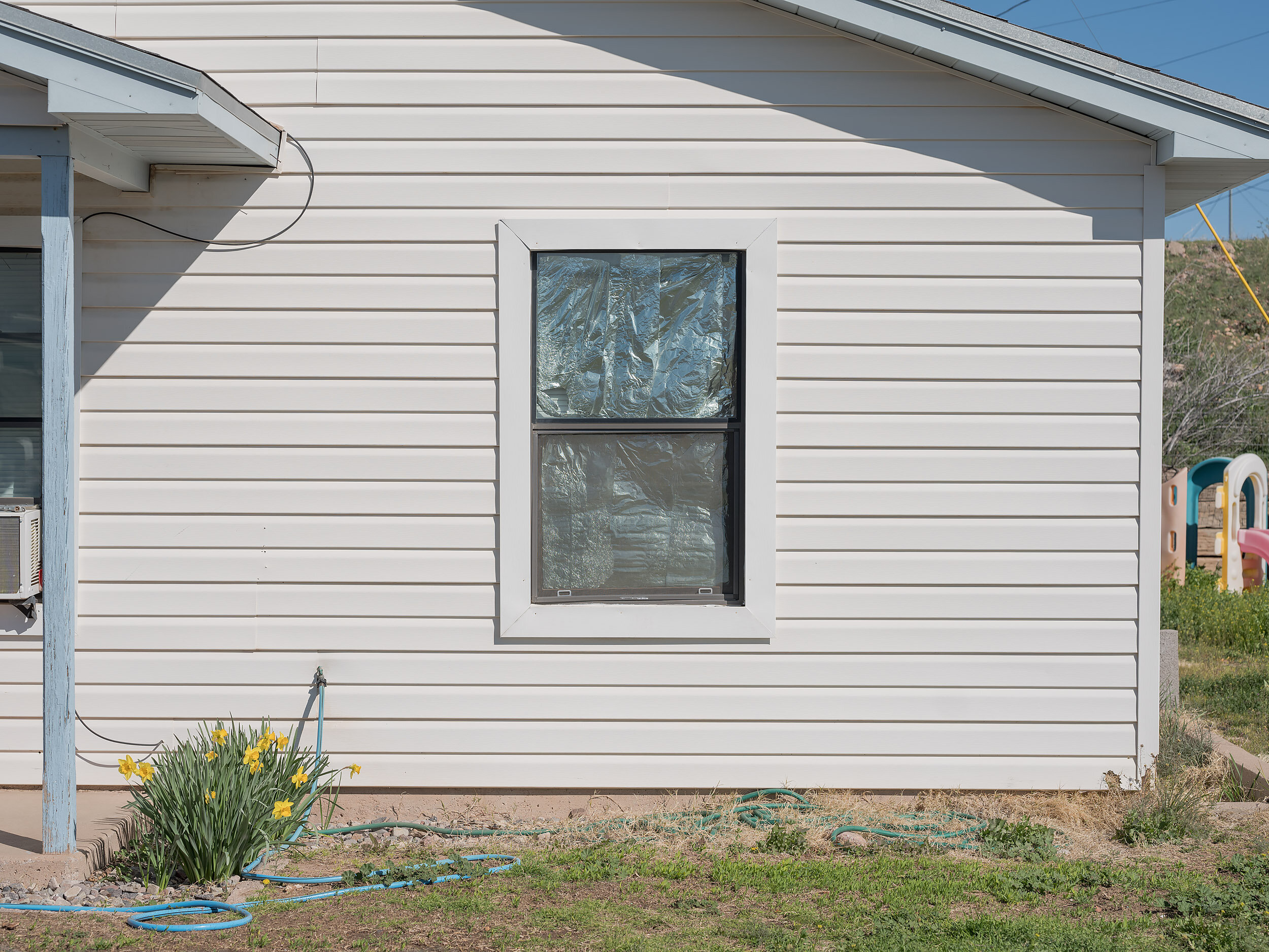 Common in Morenci foiled-windows to block the Arizona sun. Freeport-McMoran operates the mine 24/7, necessitating shift work. Home Owners Associations (HOAs) often ban such window treatments.