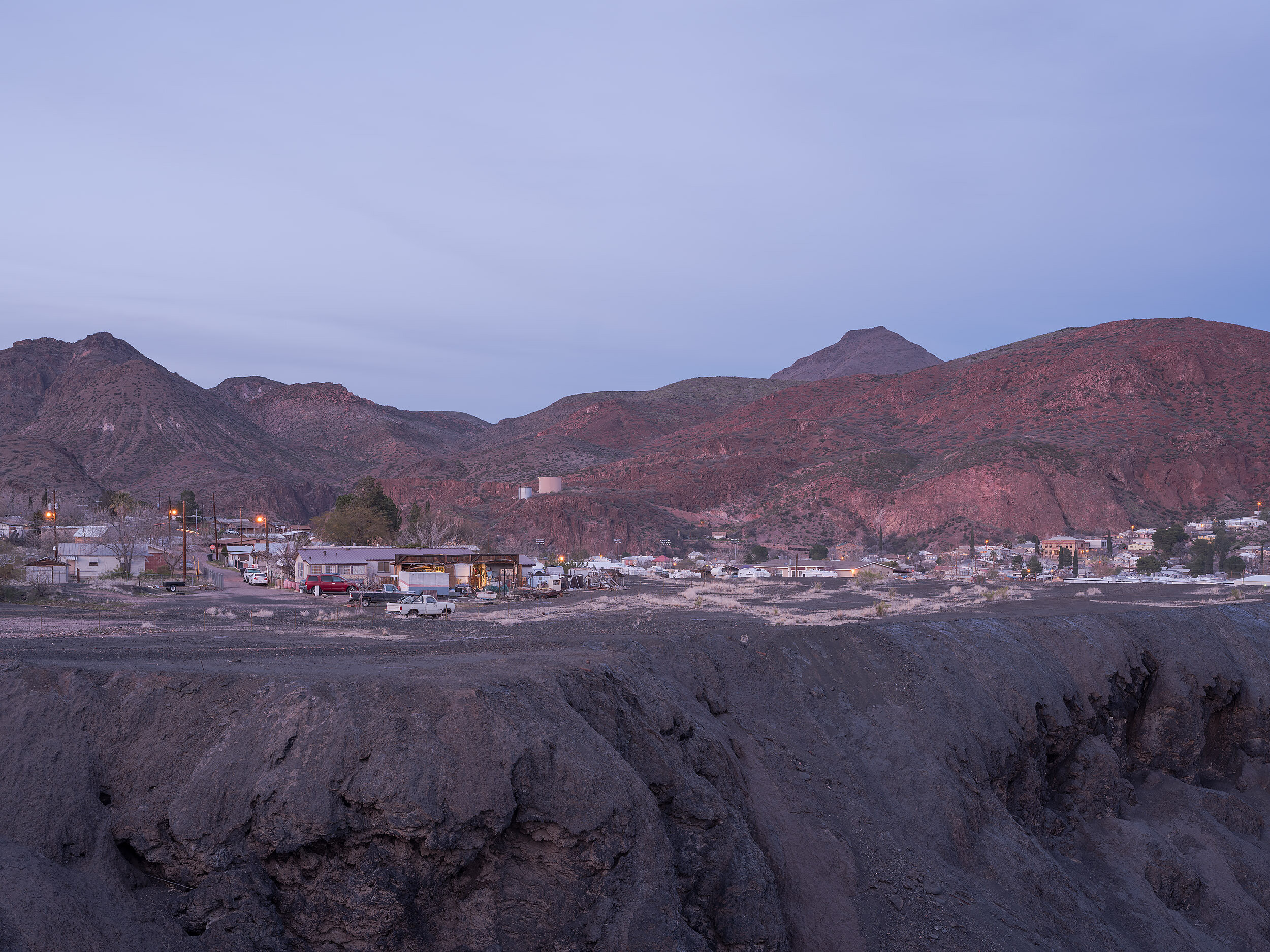  A portion of neighboring Clifton appears to built upon slag, a byproduct of the copper smelting process. In 1984, owned by Phelps-Dodge at the time, the Morenci Mine abandoned smelting at this site and has since been shipping its copper concentrates