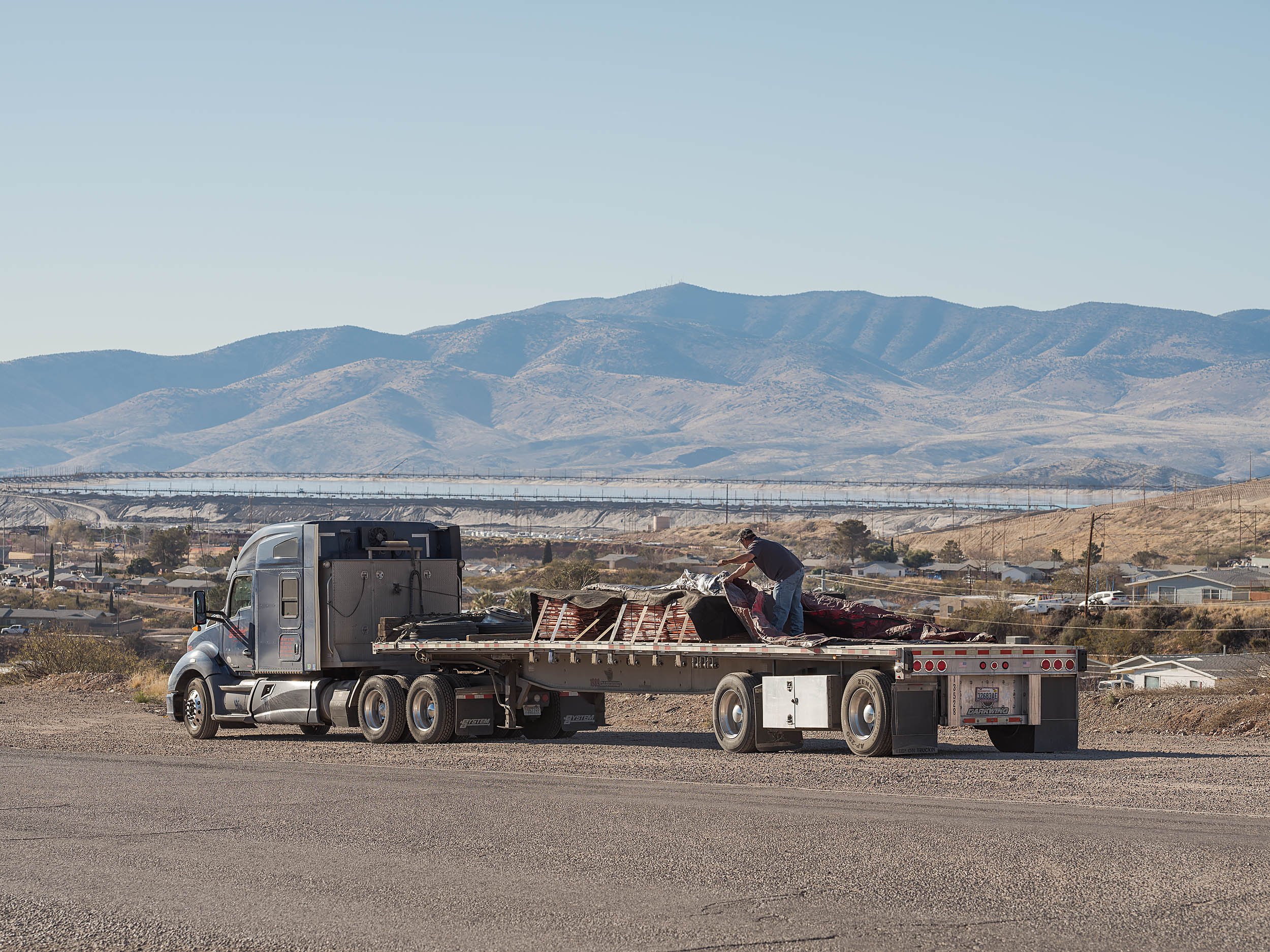 A typical load of copper cathodes being shipped out of the mine. Contracted truckers are instructed to cover the copper with tarps for security and driver safety. 