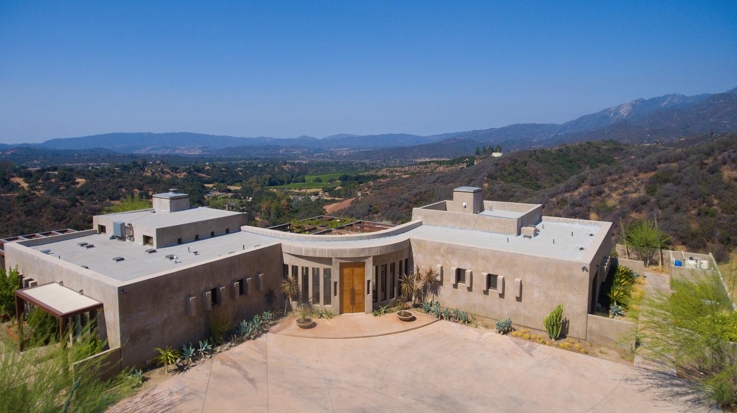 An architectural masterpiece - Sitting on 20 acres that backs to the Los Padres National Forest yet is just minutes to downtown Ojai. In a league of its own, the main house sits atop a hill with panoramic vistas of the Ojai Valley, four large and spacious bedrooms with massive ceiling heights capturing the views from every angle. With a sophisticated and modern touch, the detail and quality consists of a plaster wall finish, top of the line appliances and an infinity pool that captures the essence of fine Ojai living. The guest house sits completely separate from the main house. With its own private infinity pool, the main living area includes a full kitchen and living space that has folding patio doors that open to take in even more vistas and to enjoy the Ojai climate. A second accessory structure makes for a perfect office/art studio or extension of the guest living space. A truly incredible Ojai retreat.
