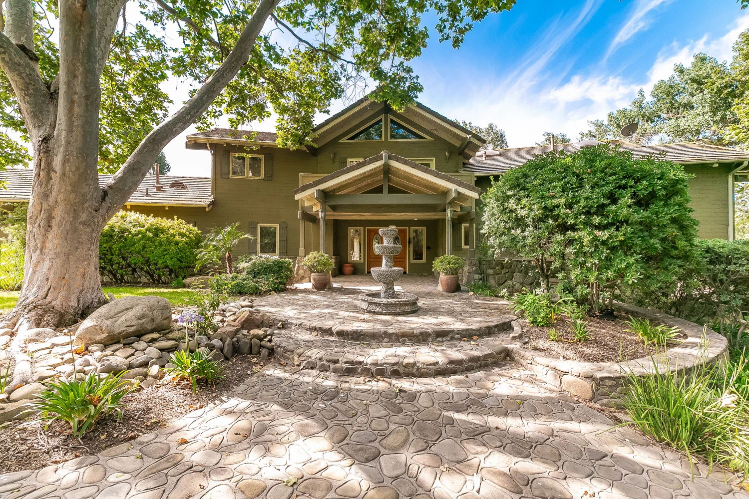 Beautiful equestrian estate in Ojai's picturesque valley, located 4.7 miles from Downtown Ojai, is available to be your personal rejuvenating retreat. Towering oaks shade the secluded ranch/lodge-style home. Designed by local and award-winning Whitman Architectural Design, this home boasts vaulted wood beamed ceilings, rock feature accents and a grand fireplace. The 5,000 square feet split level design provides: five bedrooms, five bathrooms, formal and casual dining, game room, media room, spacious master suite, and much more. Step outside to your outdoor entertaining space which includes a swimming pool/spa surrounded by river rock patios and a built-in grill. In addition to the beautiful home, situated on the approximate 13 acre property, is an operational and income generating equestrian center. Facilities include: main barn with sixty 12x12 indoor stalls, twenty 12X24 covered paddocks, 4 indoor wash racks, 2 tack rooms, 320'X120' show arena, training arena, round pen, hot walker.