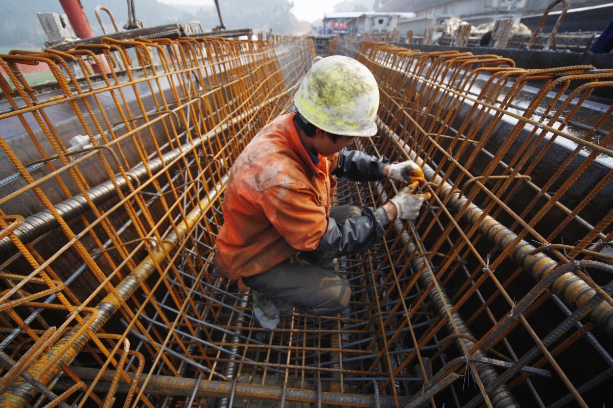A Chinese laborer works at a railway construction site in Suining, southwest China’s Sichuan province on March 5, 2011. (Photo: STR/AFP/Getty Images)