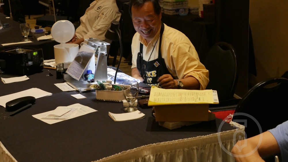 Mike Masuyama working hard & enjoying the attendees 