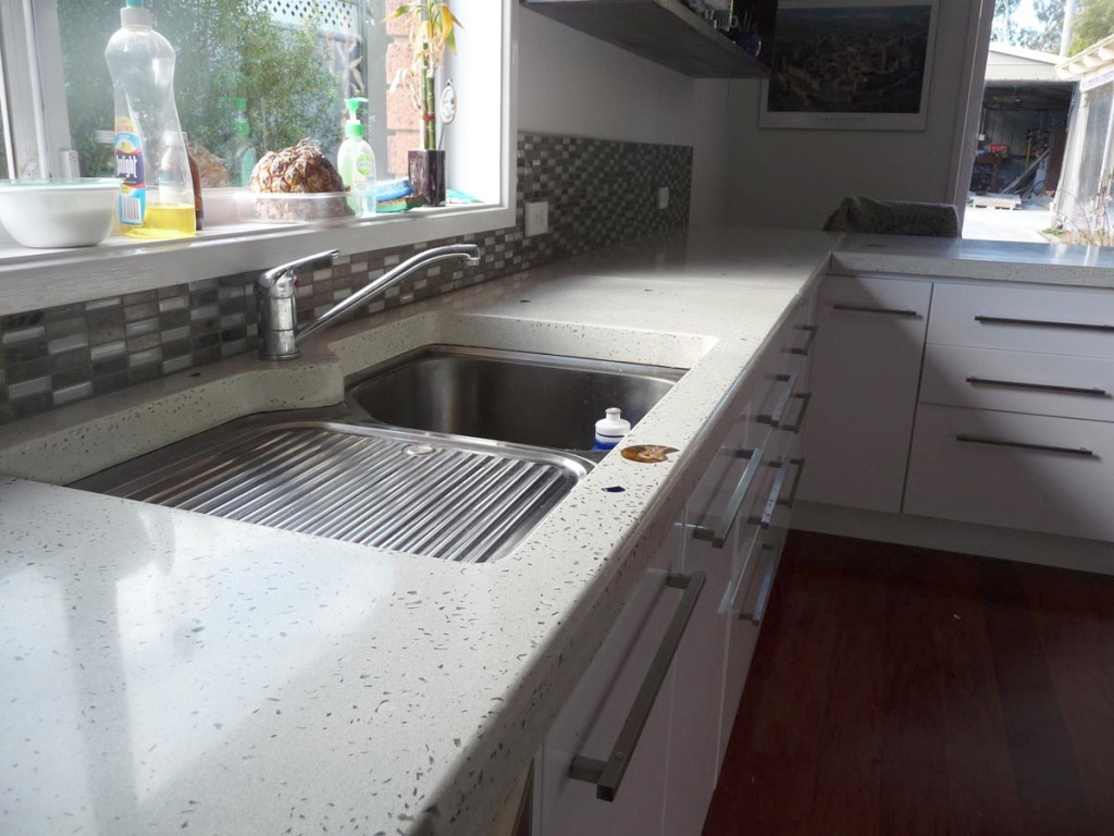 White benchtop with glass and fossils