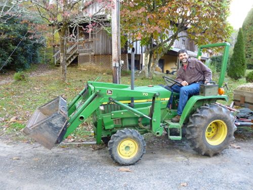 Four hours of tractor work, can include scraping your driveway, bush-hogging a field, moving dirt or mulch with a loader bucket, or a hay ride for a child's party. - Gib Barrus + Camp Celo