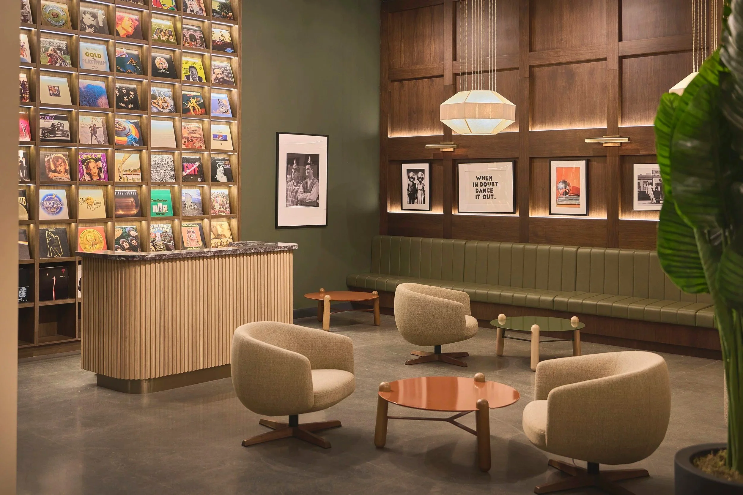 Student lounge with record wall at ALMA ByWard Market in Ottawa, interior design by Black Bee Studio