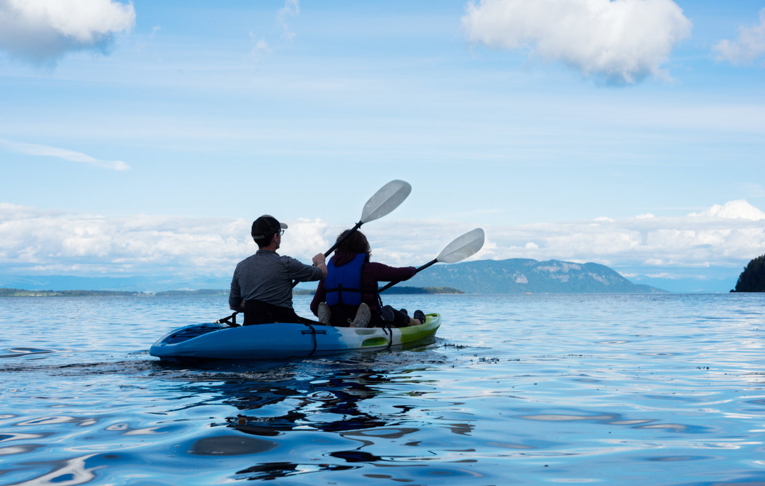 Man and woman kayaking on water
