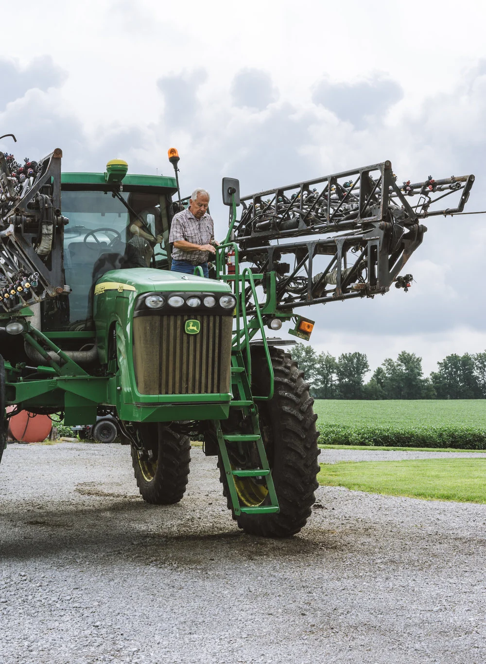 John Deer tractor with old farmer