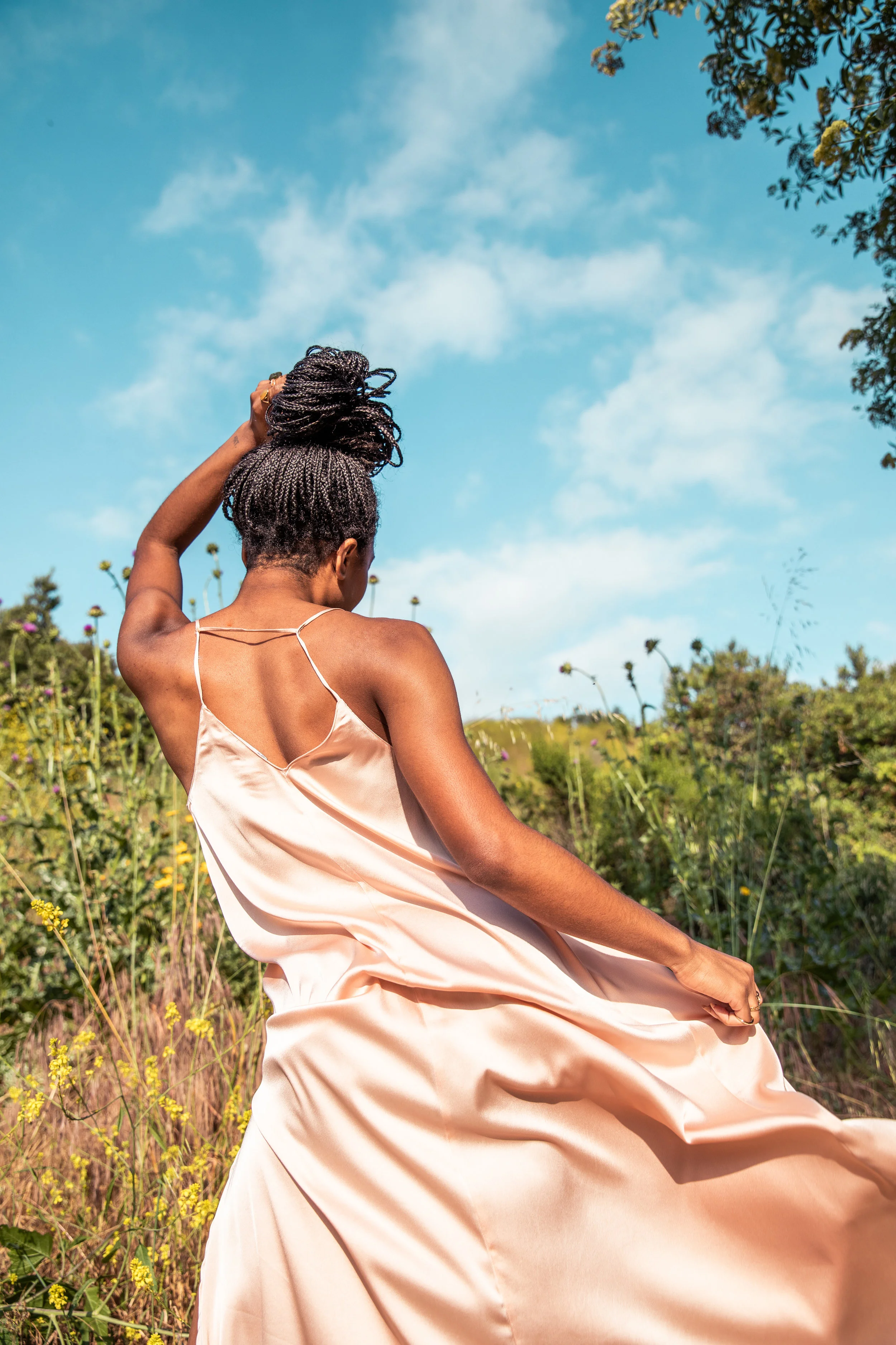 African American woman in silk dress in the wind