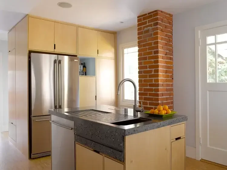 kitchen-island-concrete-countertop-exposed-brick.webp.webp