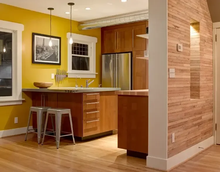 modern-kitchen-yellow-walls-wood-slat-divider.webp.webp