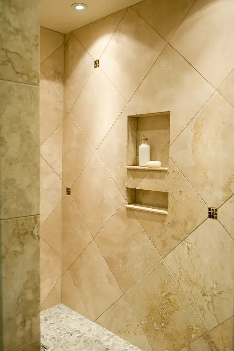 travertine-shower-niche-pebble-floor.webp.webp