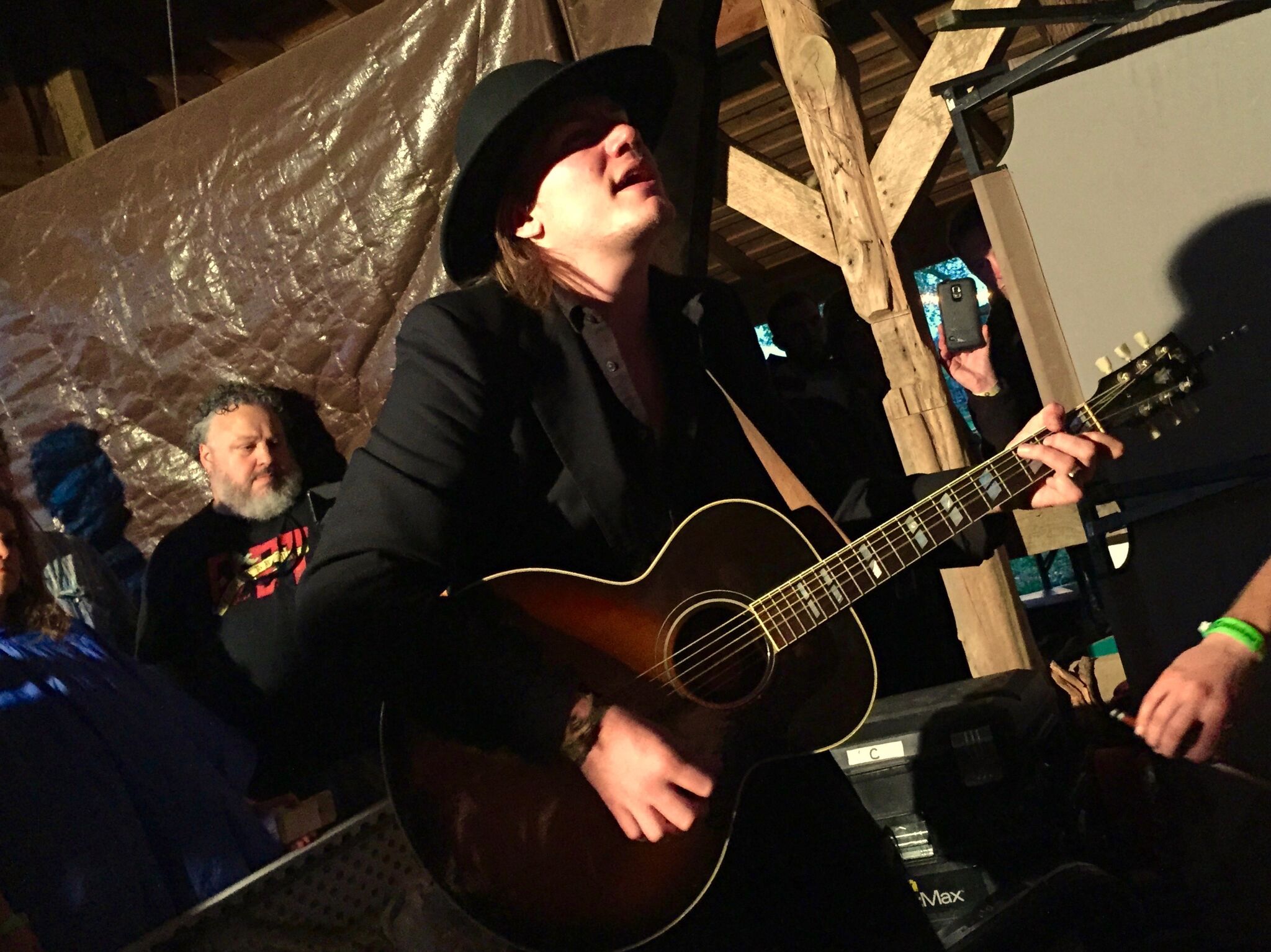 Dylan playing in the barn during the storm at the 2016 Luck Reunion. Photo By: Al Giesler