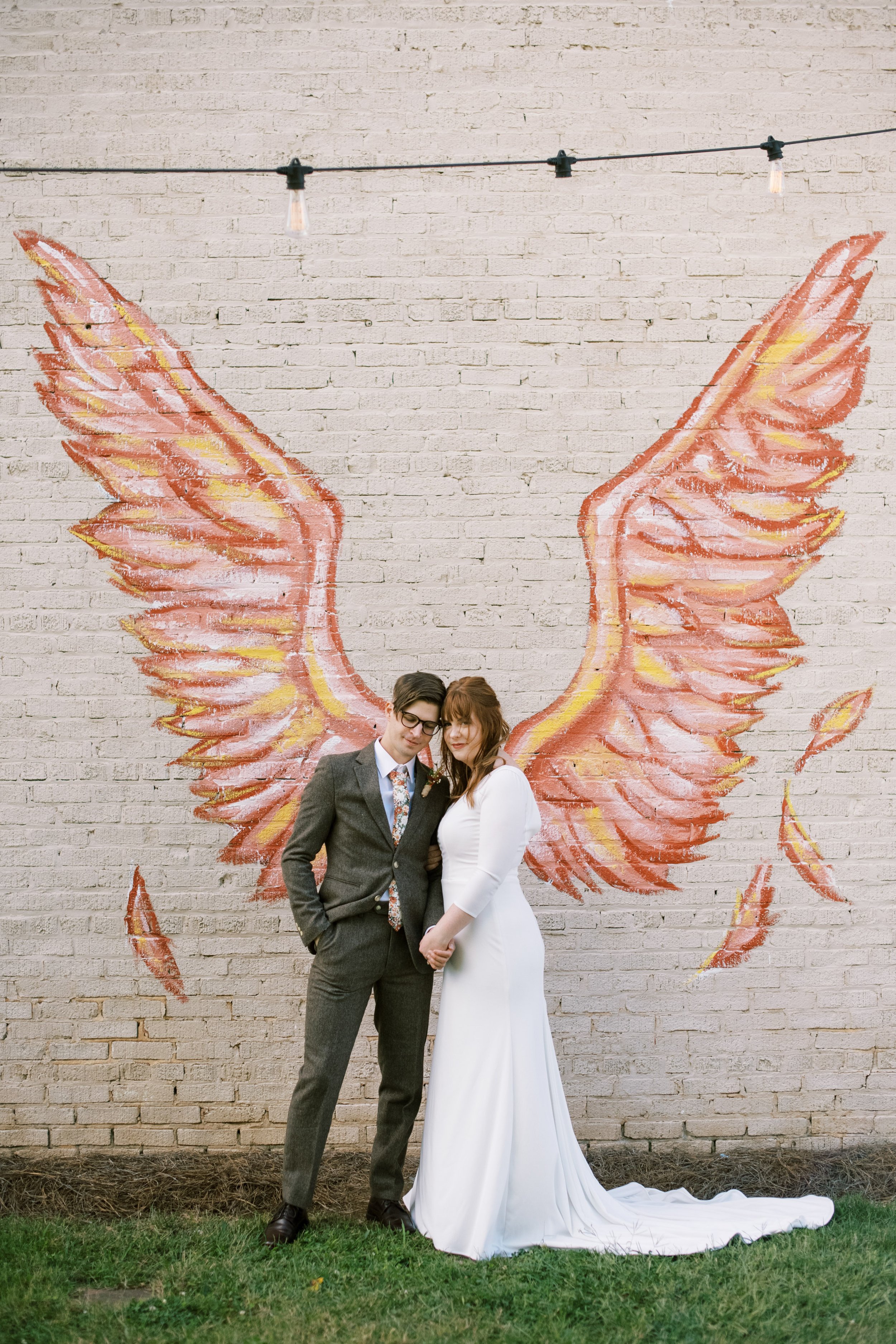 Bride Groom Angel Wing Mural Wedding at The Bottle Factory Monroe NC Fancy This Photography