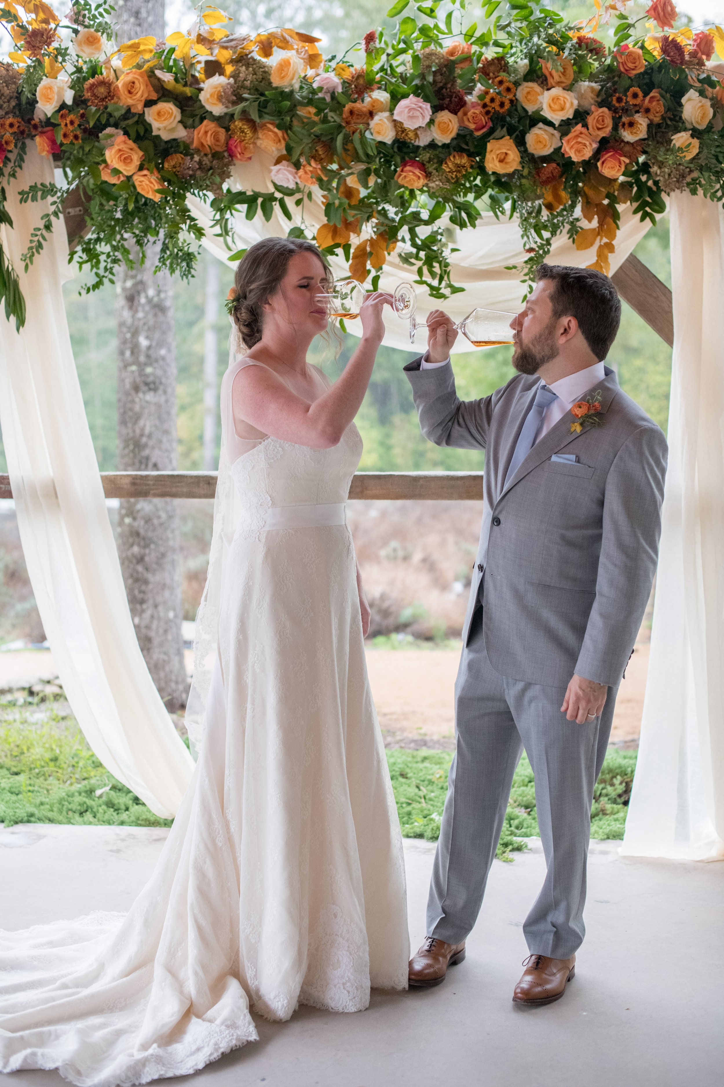 Bride and Groom Burying the Bourbon Lavender Oaks Farm Chapel Hill NC Wedding Fancy This Photography