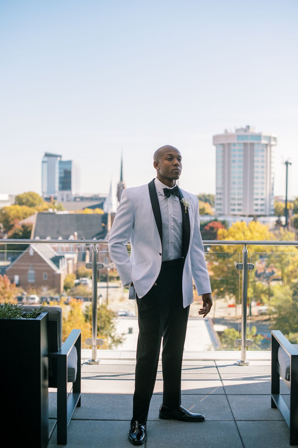 Groom White Tuxedo The Willard Rooftop Lounge at AC Hotel Raleigh Downtown Fancy This Photography