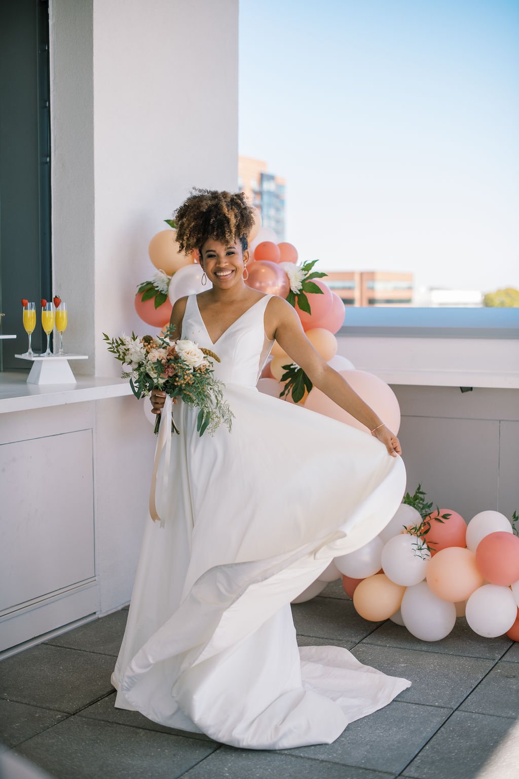 Bride Twirl Wedding Dress Balloons The Willard Rooftop Lounge at AC Hotel Raleigh Downtown Fancy This Photography